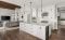 open area white kitchen with recessed lighting